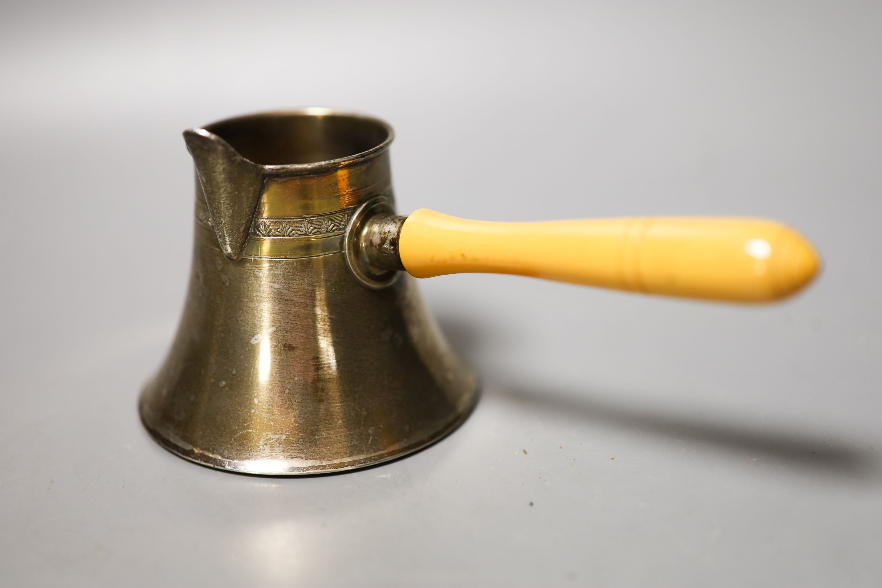 A 20th century Egyptian white metal brandy pan, a plated Dupont lighter, double measure and compact.